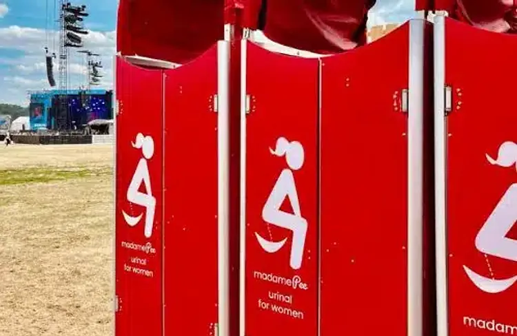 madamePee units installed on a festival field